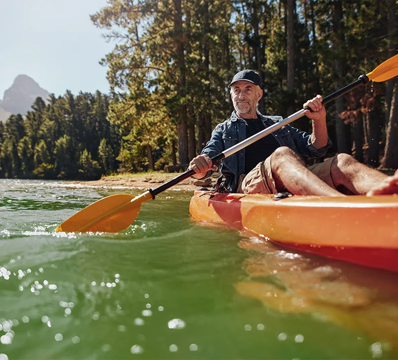 senior man kayaking on the lake